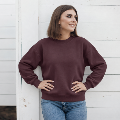 Bordeaux crewneck color mockup shown on a model; embroidery added through personalization