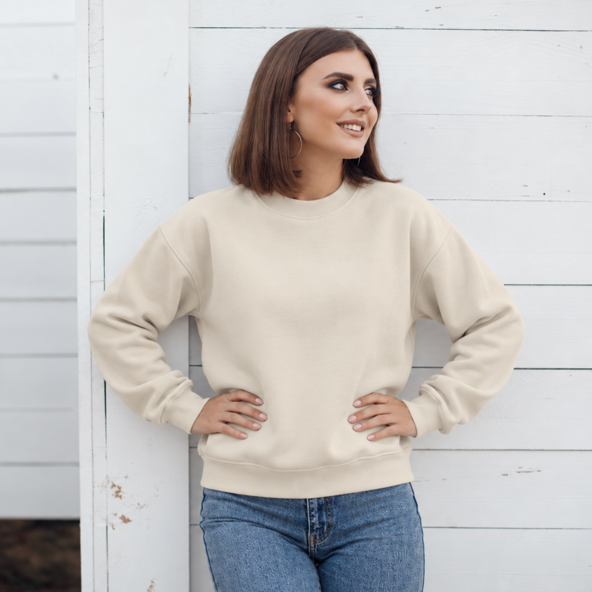 Greige crewneck color mockup shown on a model; embroidery added through personalization